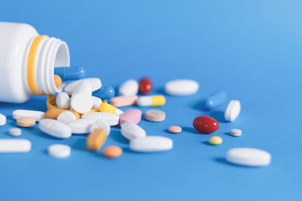 a closeup of a pile of drug pills