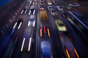 Blurred image of cars driving on highway at night